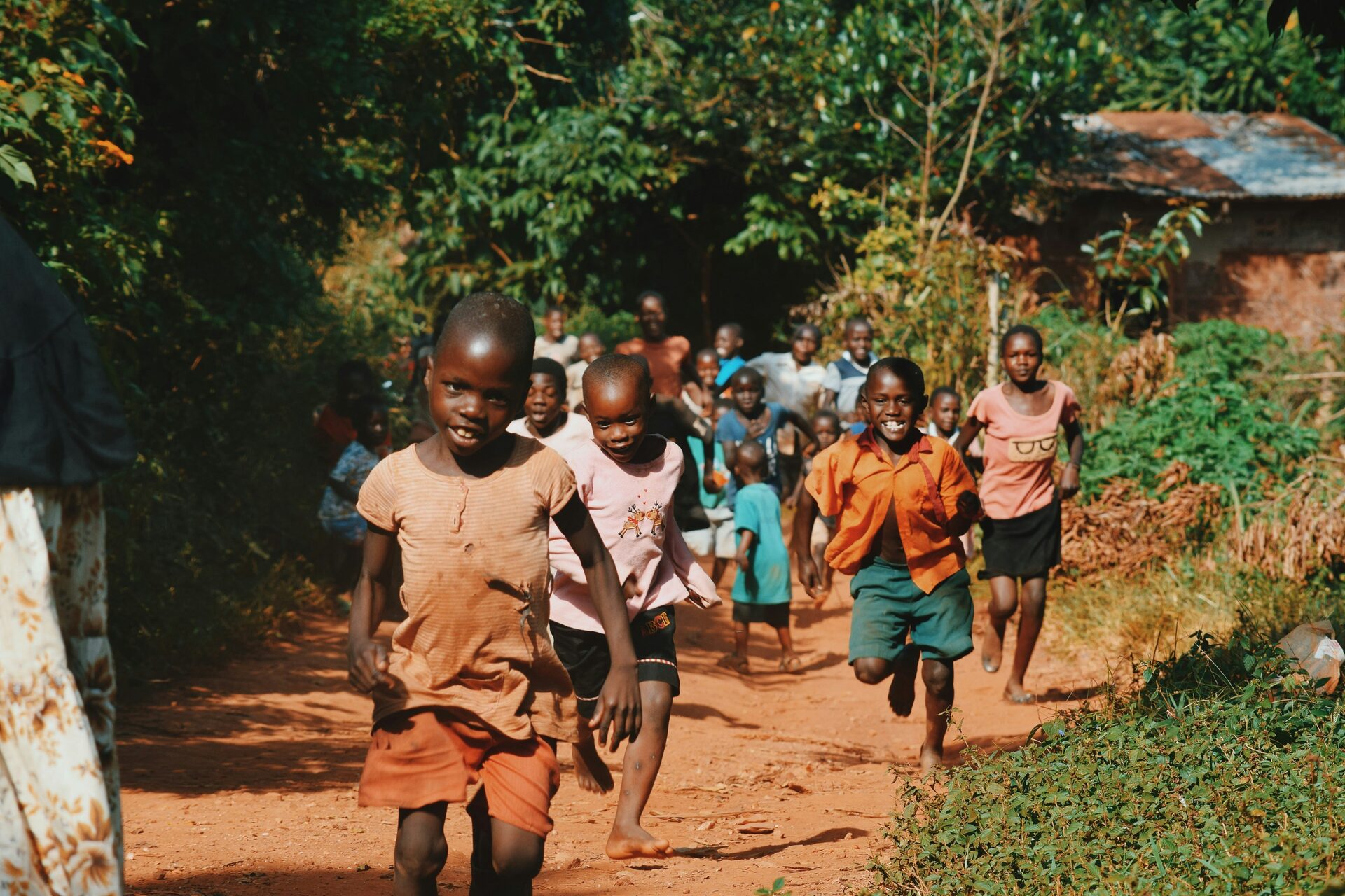 Children walking together along a path in their community