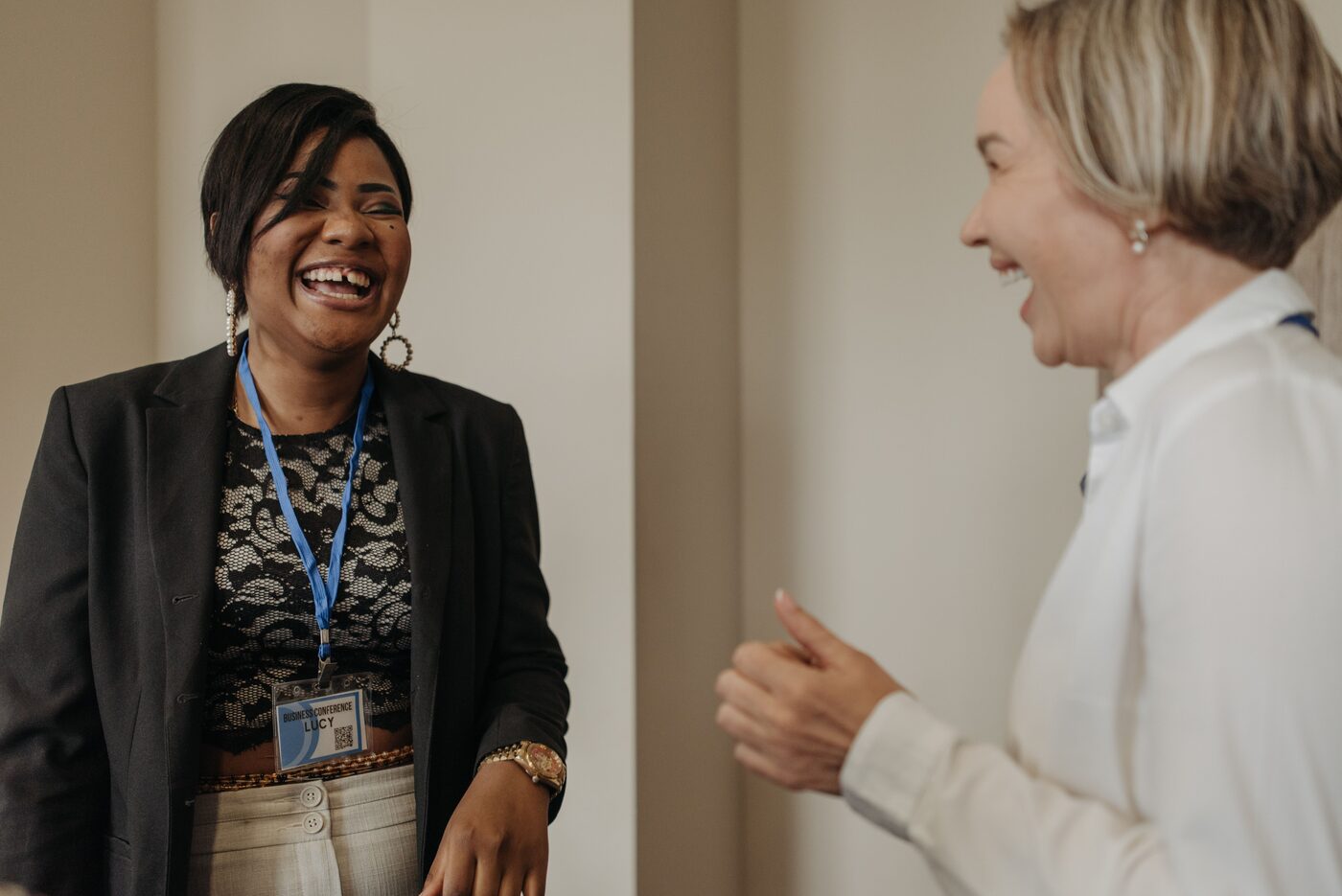 An older mentor talking with a young student